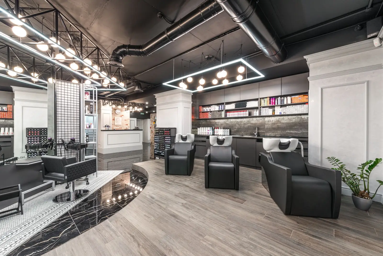 Bright salon floor with round lit mirrors