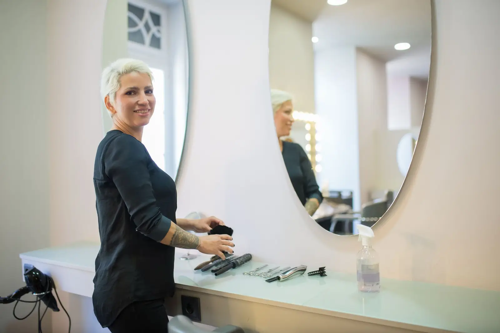 Stylist working at a mirror in the salon
